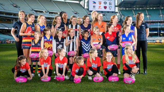 Daisy Pearce (far right) with fellow players and potential future stars at the launch of the league.