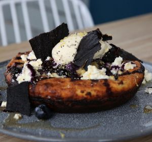 Buttermilk hotcake with shards of blueberry 'leather'.