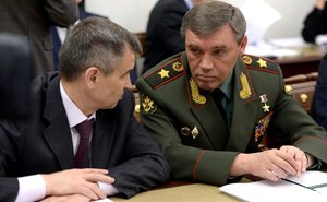 Deputy Secretary of the Security Council Rashid Nurgaliyev (left) and Chief of the General Staff of the Armed Forces and First Deputy Defence Minister Valery Gerasimov before a Security Council meeting