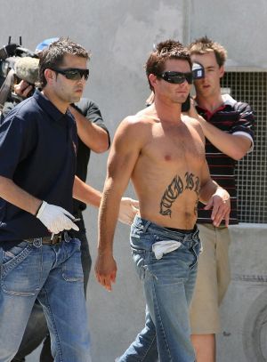 Cousins after this infamous public arrest in 2007... West Coast sacked him shortly after.