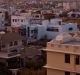 High angle view of rooftops of city Udaipur in India at sunset. Hills in the background. india