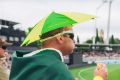 Australian fans enjoying chip sandwhiches in the crowd.