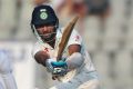 India's Cheteshwar Pujara finds runs on the leg side on an unhappy second day for England in Mumbai.