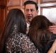 Support: Andy Woodward is comforted by his partner Zelda Worthington and stepdaughter Isabella at the launch of the ...