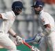 Big partnership: Murali Vijay, right, and Cheteshwar Pujara chase down England's total on the second day of the fourth Test.