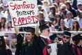 Graduating student Andrea Lorei, who helped organise campus demonstrations following the Brock Turner case, holds a sign ...