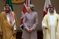 British Prime Minister Theresa May is flanked by King Salman of Saudi Arabia (left) and King Hamad of Bahrain during her ...