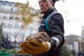 A Paris city employee shows a dead rat.