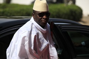 FILE- In this Thursday, Feb. 27, 2014, file photo, Gambia's President Yahya Jammeh arrives for a summit to address a seminar on security during an event marking the centenary of the unification of Nigeria's north and south in Abuja, Nigeria. Gambian activists and politicians have called on West Africa's economic body to take actions against Gambia for its brutal crackdown on rights to freedom of expression and peaceful assembly in the run-up to elections later in the year. The calls come as Amnesty International released a report Thursday, June 2, 2016, that says amid opposition protests, peaceful demonstrators and bystanders were beaten and arrested in April and May.