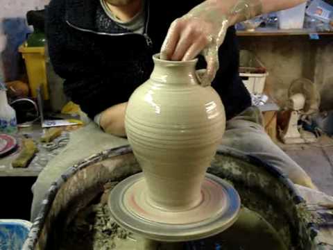 Making Throwing a Pottery Greek Roman Amphora Vase on the wheel