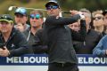 Refocused: Adam Scott tees off on day three of the World Cup of Golf at Kingston Heath Golf Club.