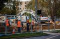 Fencing is erected on Northbourne Avenue as Capital Metro undergoes earthworks for the light rail project.