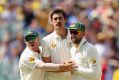 David Warner, Mitchell Starc and Nathan Lyon celebrate a wicket.