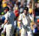 David Warner salutes after notching his half-century