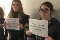 Students protest against Columbia University's wrestling team following the publication of sexist and racist messages ...
