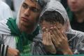 Grief-stricken: Fans at a Chapecoense memorial service.