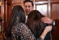 Support: Andy Woodward is comforted by his partner Zelda Worthington and stepdaughter Isabella at the launch of the ...