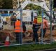 Fencing is erected on Northbourne Avenue as Capital Metro undergoes earthworks for the light rail project.