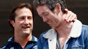 Luke Beveridge, senior coach of the Bulldogs and captain Robert Murphy embrace.