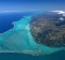 View from the top: Turquoise lagoon with saltwater channels and white sandy beach.