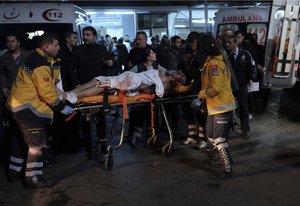 Rescue and medics carry a wounded person after attacks in Istanbul, late Saturday, Dec. 10, 2016. Two explosions struck Saturday night outside a major soccer stadium in Istanbul after fans had gone home, an attack that wounded about 20 police officers, Turkish authorities said. One of the blasts was thought to be a car bomb. Turkish authorities have banned distribution of images relating to the Istanbul explosions within Turkey.