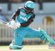 Free scoring: Deandra Dottin plays a reverse sweep shot at North Sydney Oval.