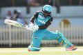 Free scoring: Deandra Dottin plays a reverse sweep shot at North Sydney Oval.