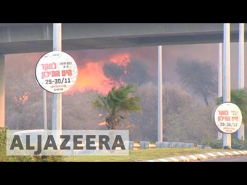 Israel: Thousands ordered to leave after massive fires hit Haifa