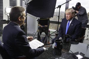 President-elect Donald Trump, right, is interviewed by Chris Wallace of "Fox News Sunday" at Trump Tower in New York, Saturday, Dec. 10, 2016.