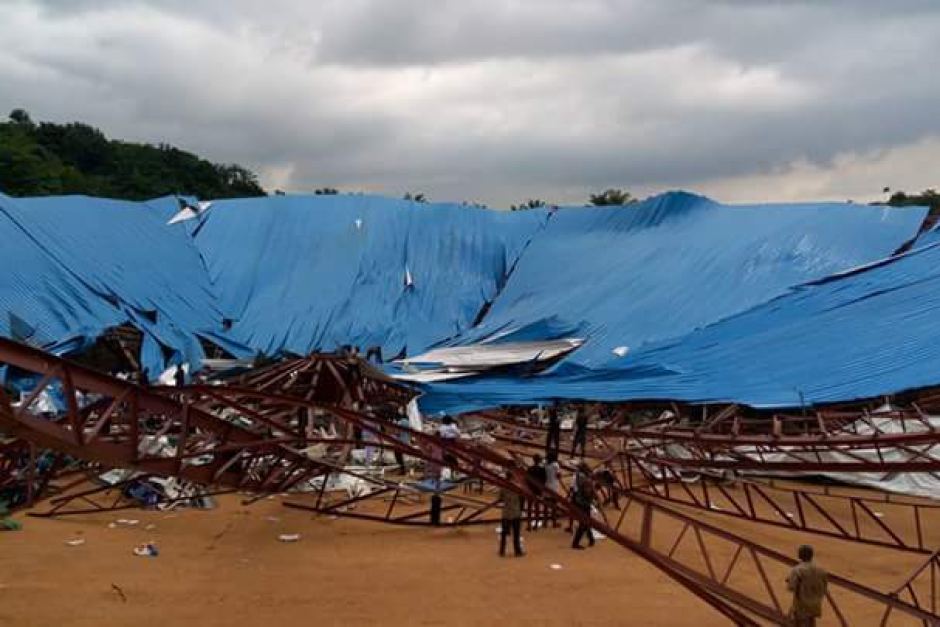 People gathered at the site of a collapsed church in Uyo