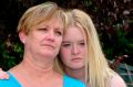 Fiona Vickery of Yass, with her daughter Sky. Her husband Wayne Vickery was killed in a work place accident in December ...