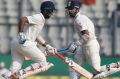 Big partnership: Murali Vijay, right, and Cheteshwar Pujara chase down England's total on the second day of the fourth Test.