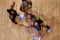 INVERCARGILL, NEW ZEALAND - OCTOBER 20: Maria Tutaia (L) of New Zealand takes a shot at goal as Clare McMeniman of ...