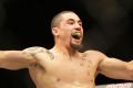 Robert Whittaker celebrates after defeating Derek Brunson.