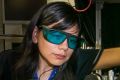 Rocio Camacho-Morales, a PhD candidate at the Australian National University. Here she adjusts the laser equipment in ...
