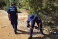 Forensic police search for clues after Michael Watson was found dead in Lesmurdie last year.