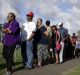 Native Fijians and ethnic Indians in a queue to vote in Fiji.