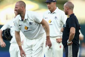 HOBART, AUSTRALIA - DECEMBER 06: John Hastings of Victoria reacts after hurting his leg during day two of the Sheffield ...