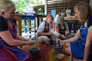 Tourists take part in a cooking class.