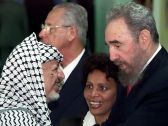 FILE: Cuba's leader Fidel Castro, right, greets Palestinian leader Yasser Arafat in Havana, Cuba. April 12, 2000. 