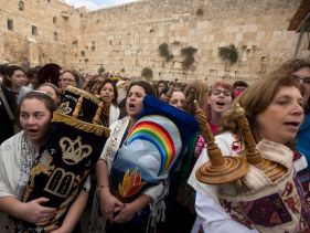 Women hold Torah scrolls as they pray at the Western Wall in Jerusalem's Old City, November 2, 2016.