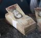 Employees organize 100-bolivar notes at a lottery store in Caracas, Venezuela, on Monday, Dec. 12, 2016. President ...