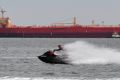 A jetskier enjoys on Port Phillip Bay enjoys the burst of hot weather.  