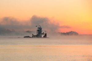 A tow boat travels along the Ohio River just before sunrise near Paducah.