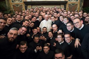 Pope Francis poses with members of the International Rural Catholic Association, at the Vatican Saturday, Dec. 10, 2016.