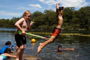 Cooper Shum, 10, jumps into Lake Parramatta on a hot day in Sydney.