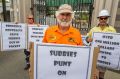 Subcontractor Barry Mitchell protests at the Eagle Farm redevelopment where two men were crushed to death, claiming he ...