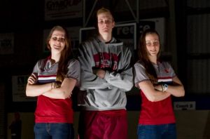 Harry Froling with sisters Keely and Alicia in 2014.