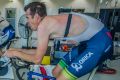 Mathew Hayman trains with the Orica-BikeExchange team at the AIS on Thursday.