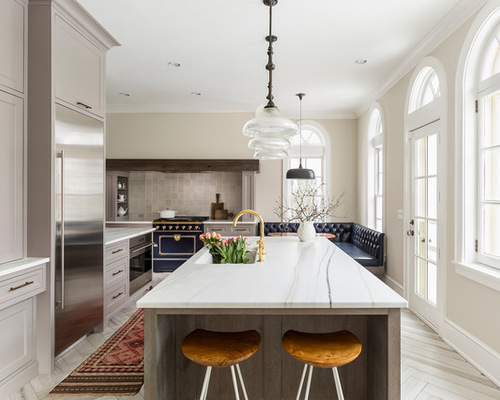 Inspiration for a large transitional l-shaped eat-in kitchen remodel with an undermount sink, recessed-panel cabinets, gray cabinets, marble countertops, gray backsplash, ceramic backsplash, colored appliances, porcelain floors and an island